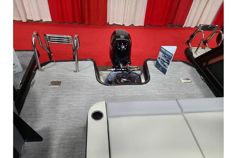 Slide: The Image of Starcraft VX 22Q DH 2026 boat rear with motor and ladder. - 10