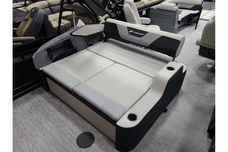 Slide: The Image of Starcraft VX 22Q DH 2026 boat seating with gray upholstery. - 11