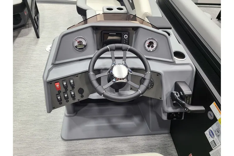 Slide: The Image of Starcraft VX 22Q DH 2026 helm with steering wheel and controls. - 13