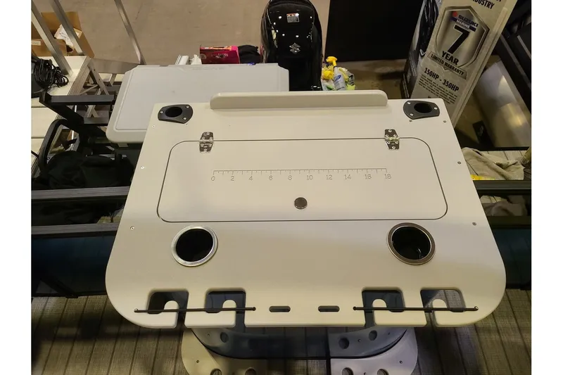 Slide: The Image of Starcraft VX 20FD 2026 boat table with cup holders and measurement scale. - 10