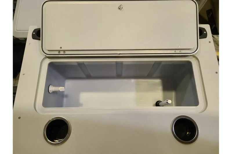 Slide: The Image of Starcraft VX 20FD 2026 boat cooler with open lid. - 11
