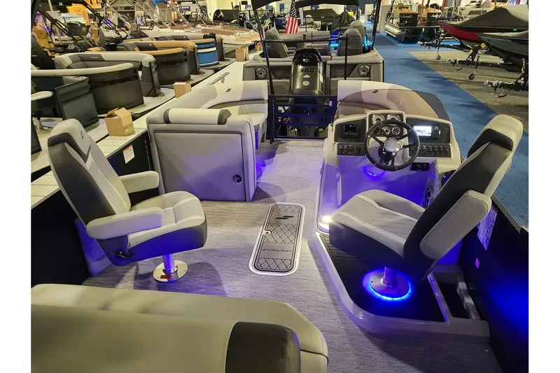 Slide: The Image of Interior of 2026 Starcraft EXS 3 DL with modern seating and helm console. - 12