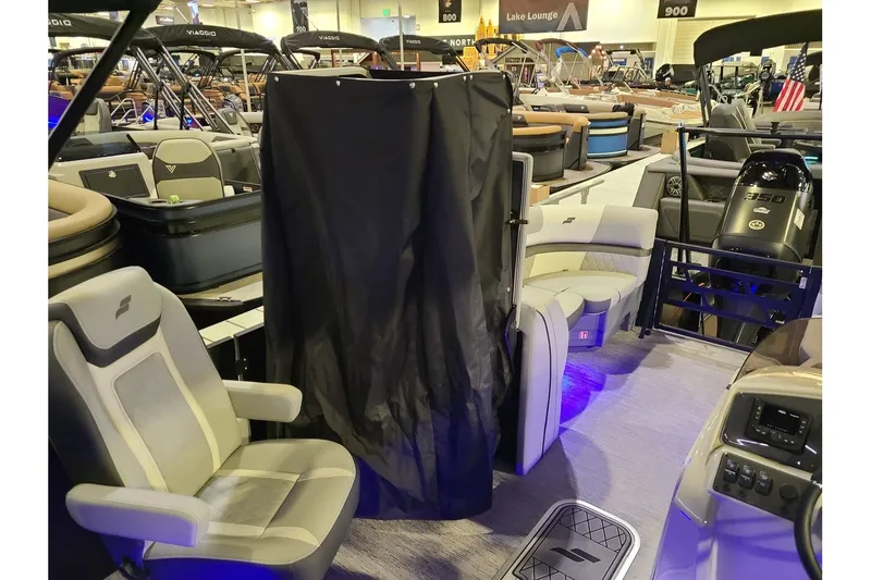 Slide: The Image of Starcraft EXS 3 DL 2026 pontoon boat at a show. - 13