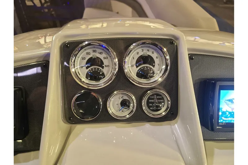 Slide: The Image of Dashboard of 2026 Starcraft EXS 3 DL with speedometer and gauges. - 17