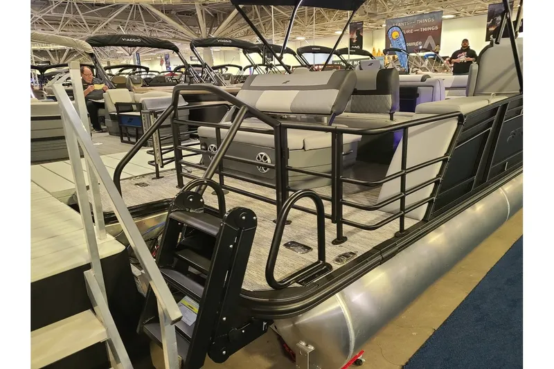 Slide: The Image of Starcraft EXS 3 DL 2026 pontoon boat at a trade show. - 3