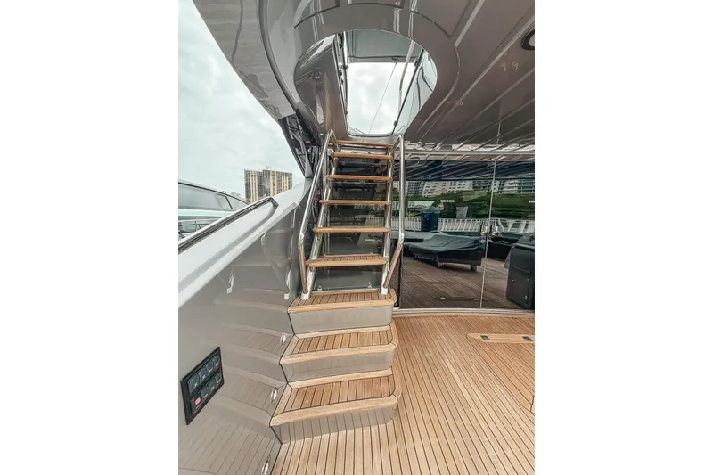 Slide: The Image of Cockpit view of 2010 Sunseeker Predator 84 yacht with modern controls and city skyline. - 16