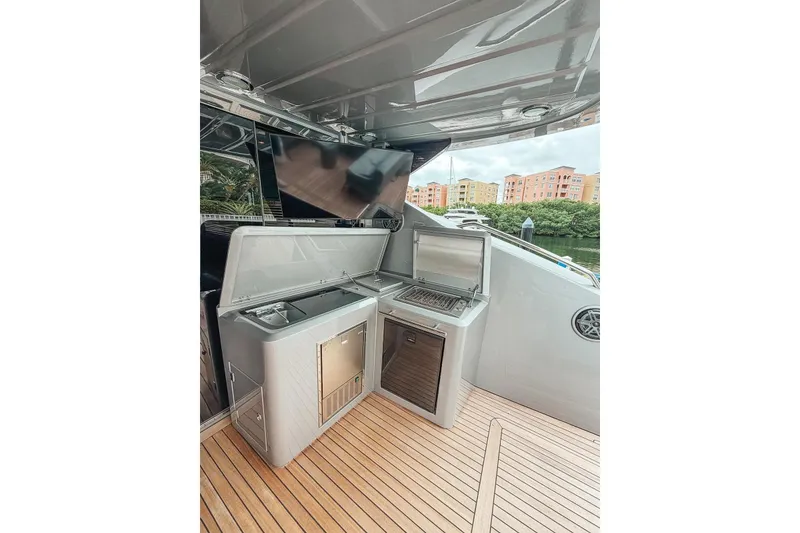 Slide: The Image of Luxury Sunseeker Predator 84 yacht, 2010 model, docked with sleek design and wooden deck. - 19