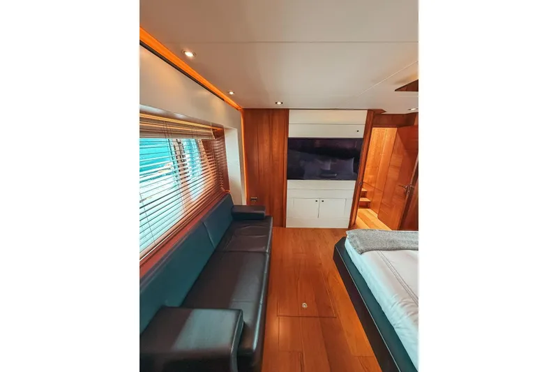 Slide: The Image of Luxurious bedroom interior of 2010 Sunseeker Predator 84 yacht with elegant wood finishes. - 22