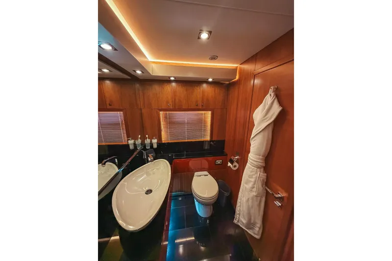 Slide: The Image of Luxurious bedroom interior of 2010 Sunseeker Predator 84 yacht with elegant wood finishes. - 23