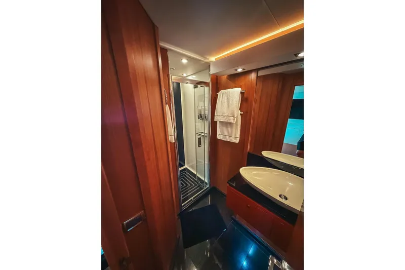 Slide: The Image of Luxurious bedroom interior of 2010 Sunseeker Predator 84 yacht with modern design elements. - 24