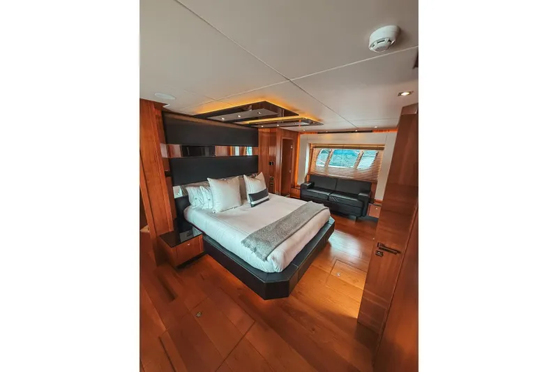 Slide: The Image of Luxurious bathroom in 2010 Sunseeker Predator 84 yacht with modern fixtures and wooden accents. - 27