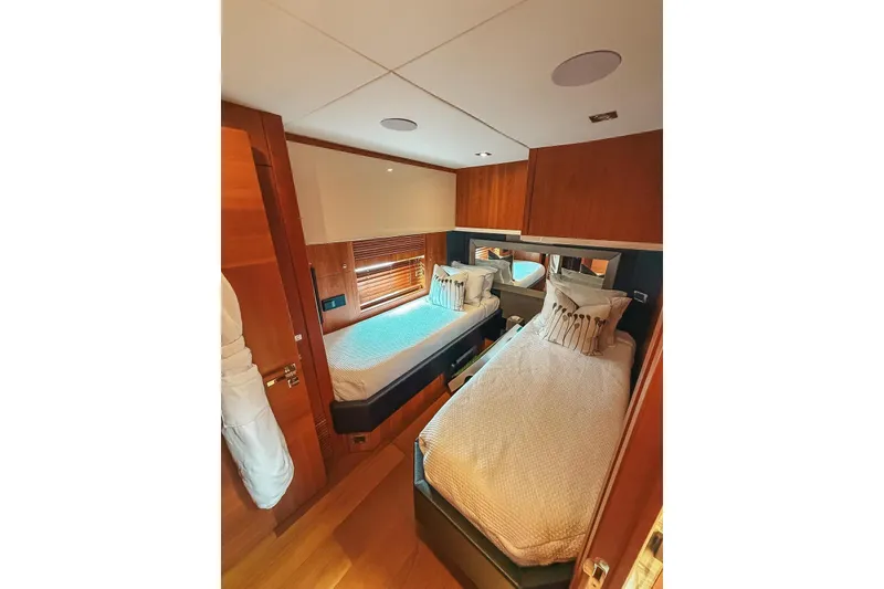 Slide: The Image of Luxurious interior of 2010 Sunseeker Predator 84 yacht, featuring wooden paneling and modern design. - 29