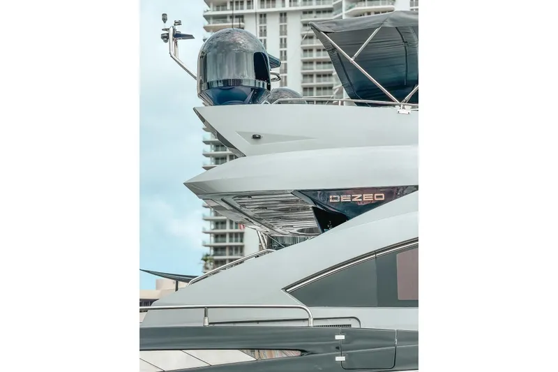 Slide: The Image of Luxury Sunseeker Predator 84 yacht docked near modern building, 2010 model. - 38