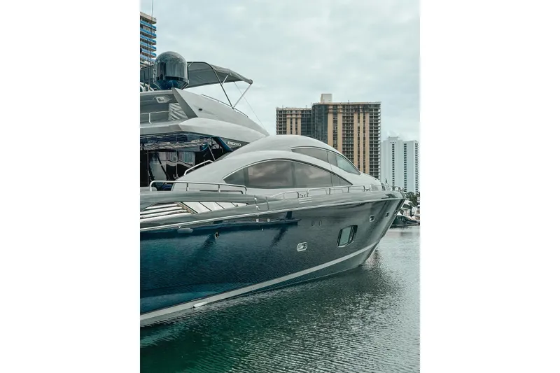 Slide: The Image of Sunseeker Predator 84 yacht, 2010 model, docked with modern architecture in background. - 39