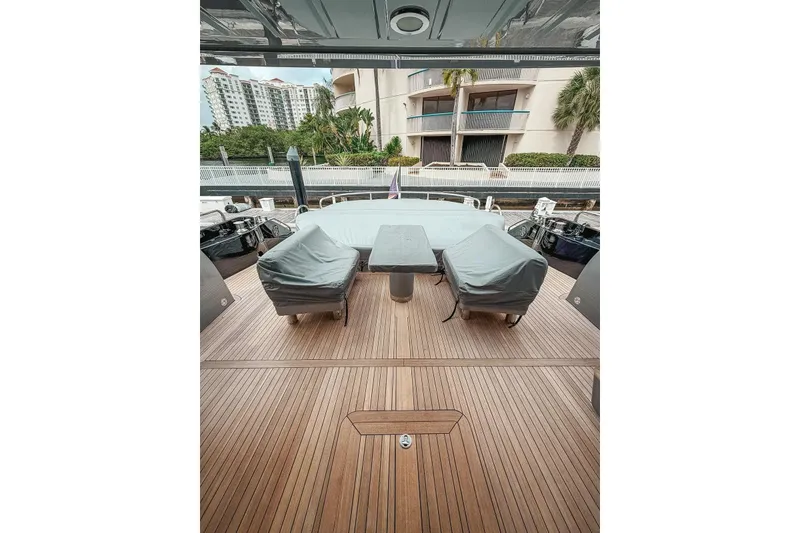 Slide: The Image of Sunseeker Predator 84 yacht deck with covered seating, 2010 model. - 4
