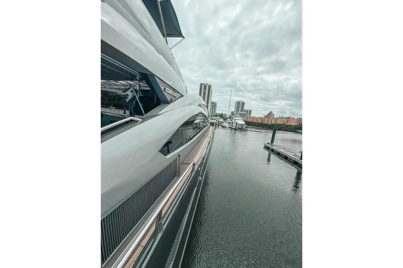 Slide: The Image of Luxury Sunseeker Predator 84 yacht docked near urban high-rise buildings, 2010 model. - 41