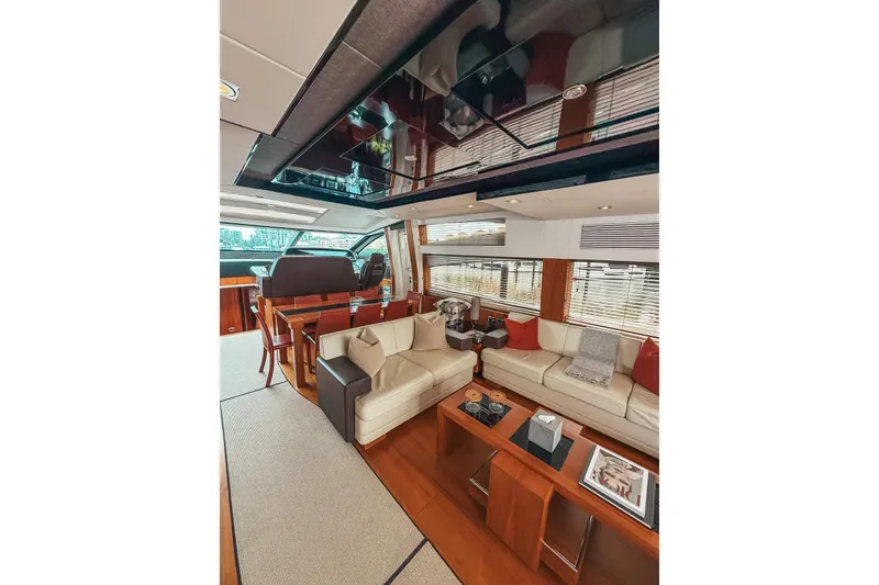 Slide: The Image of 2010 Sunseeker Predator 84 yacht docked near modern high-rise buildings. - 43