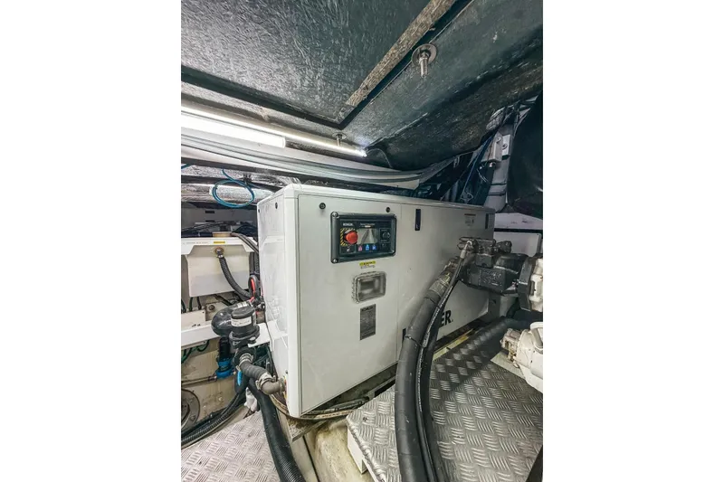 Slide: The Image of Engine room of a 2010 Sunseeker Predator 84 yacht, showcasing mechanical components. - 48