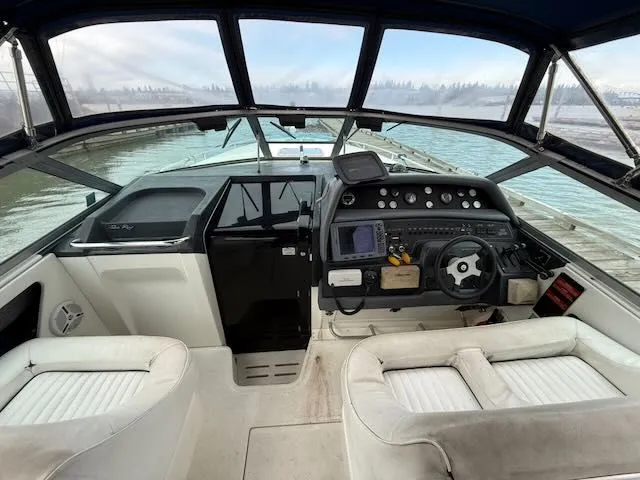 Slide: The Image of Interior view of a 1993 Sea Ray 38 Express boat cockpit. - 10