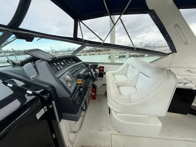Slide: The Image of Interior of a 1993 Sea Ray 38 Express yacht with helm station. - 11