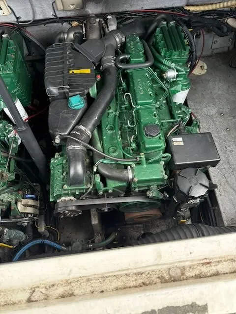 Slide: The Image of Engine compartment of a 1993 Sea Ray 38 Express boat with green engine. - 18