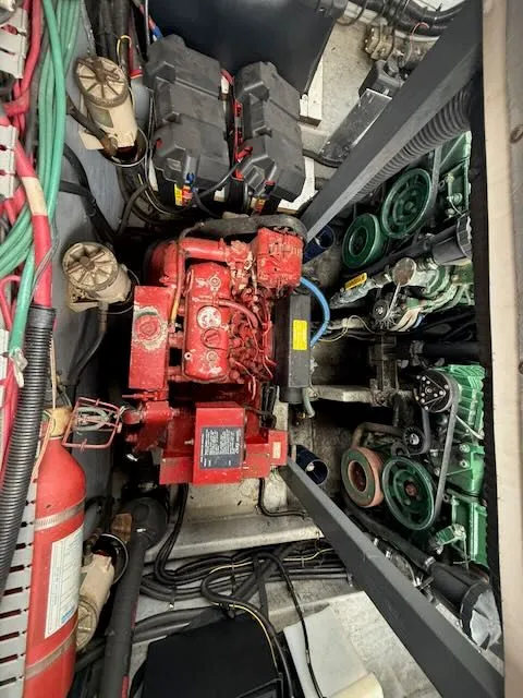 Slide: The Image of Engine room of a 1993 Sea Ray 38 Express boat with red engine. - 19