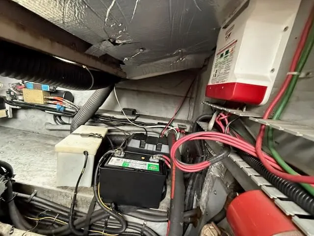 Slide: The Image of Interior of 1993 Sea Ray 38 Express showing electrical components and wiring. - 23