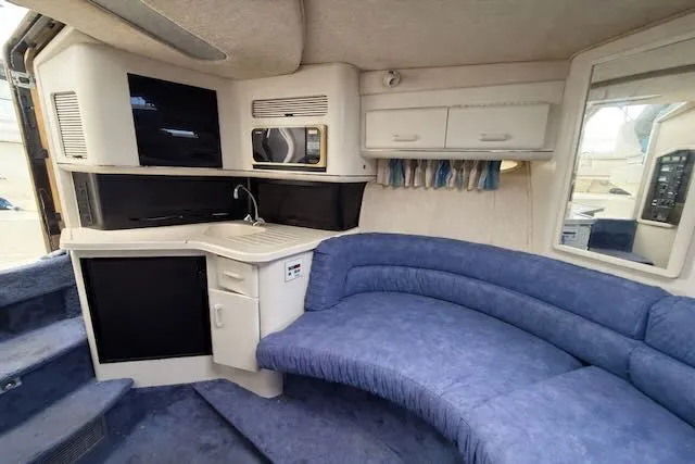 Slide: The Image of 1993 Sea Ray 38 Express yacht interior with blue upholstery. - 26