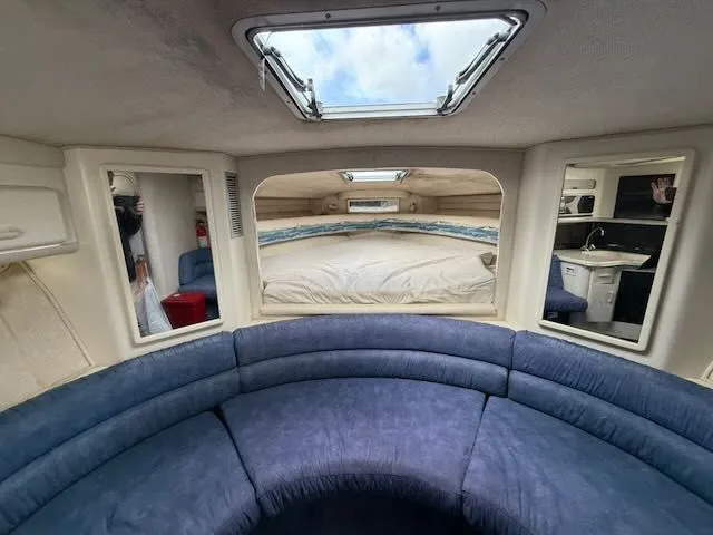 Slide: The Image of Interior of a 1993 Sea Ray 38 Express yacht with blue upholstery. - 28
