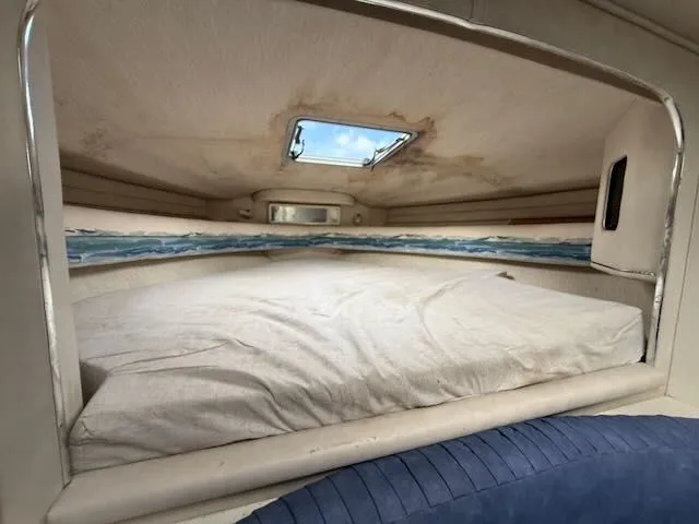 Slide: The Image of Interior of a 1993 Sea Ray 38 Express yacht with bed and skylight. - 29