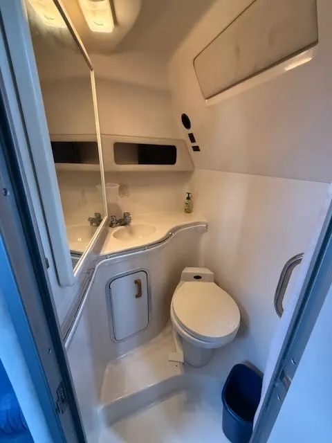 Slide: The Image of Interior of 1993 Sea Ray 38 Express, bathroom view. - 33