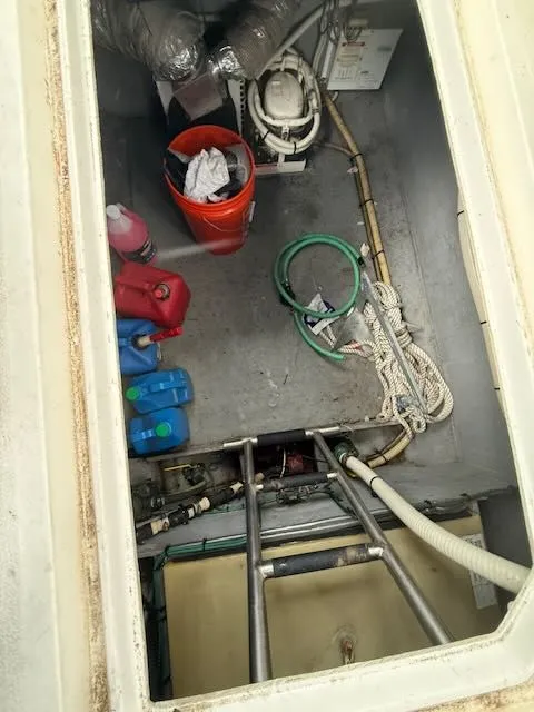 Slide: The Image of Interior of a 1993 Sea Ray 38 Express boat with equipment. - 35