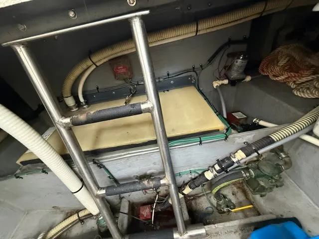 Slide: The Image of Engine room of 1993 Sea Ray 38 Express with pipes and ladder. - 36