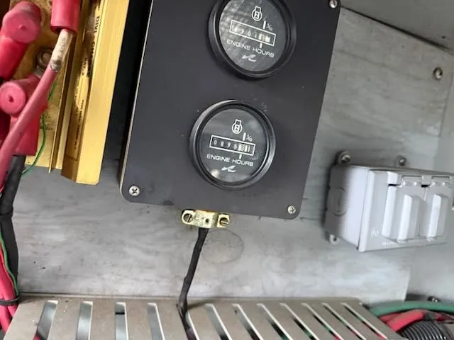 Slide: The Image of Engine hour meters on 1993 Sea Ray 38 Express. - 38