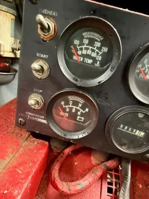 Slide: The Image of Dashboard of a 1993 Sea Ray 38 Express boat with temperature gauge. - 39