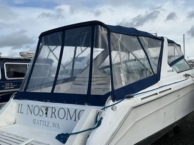 Slide: The Image of 1993 Sea Ray 38 Express boat with blue cover, Seattle. - 4