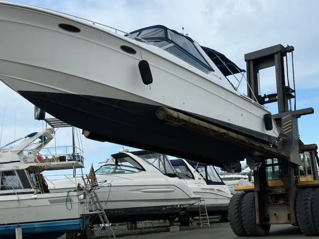 Slide: The Image of 1993 Sea Ray 38 Express on forklift at boatyard. - 43