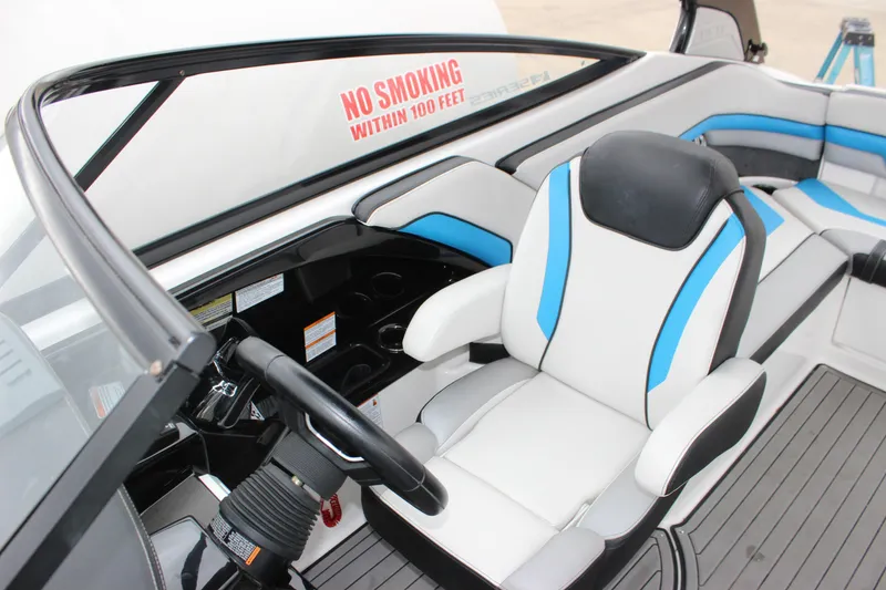 Slide: The Image of 2017 Yamaha Boats 242 Limited S E-Series cockpit with stylish seating and steering wheel. - 10