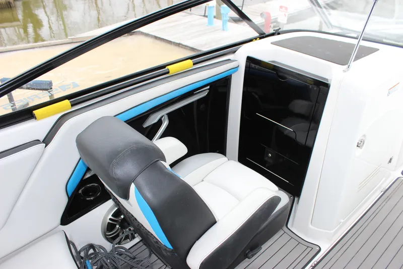 Slide: The Image of Interior of 2017 Yamaha Boats 242 Limited S E-Series, featuring sleek seating and dashboard. - 11
