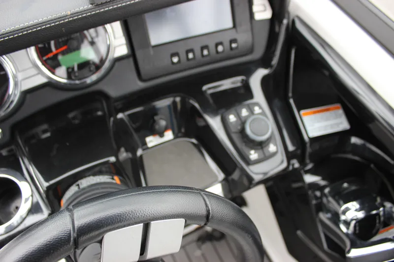 Slide: The Image of Cockpit view of 2017 Yamaha Boats 242 Limited S E-Series with steering wheel and controls. - 16