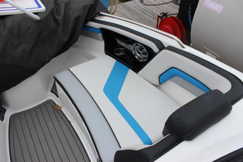 Slide: The Image of 2017 Yamaha Boats 242 Limited S E-Series interior seating with blue accents. - 18