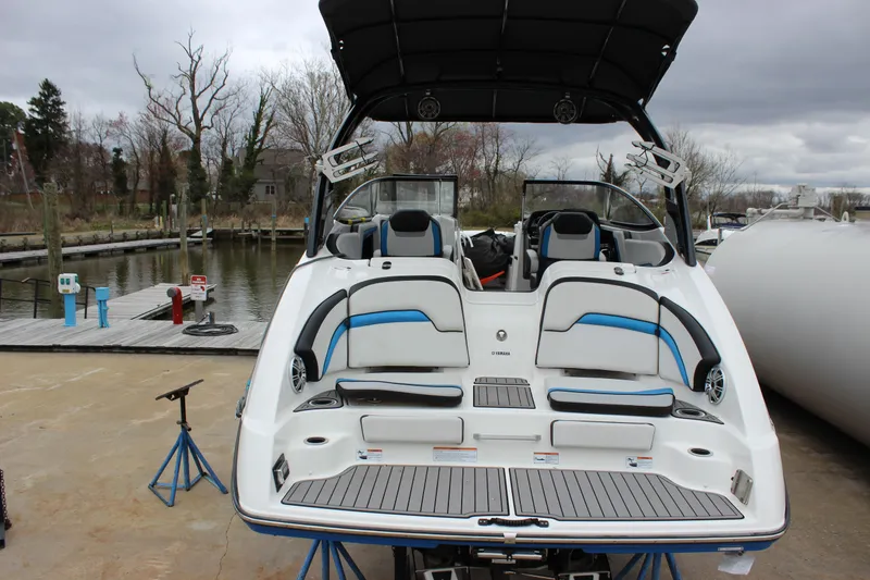 Slide: The Image of 2017 Yamaha Boats 242 Limited S E-Series on stands, dockside view. - 23