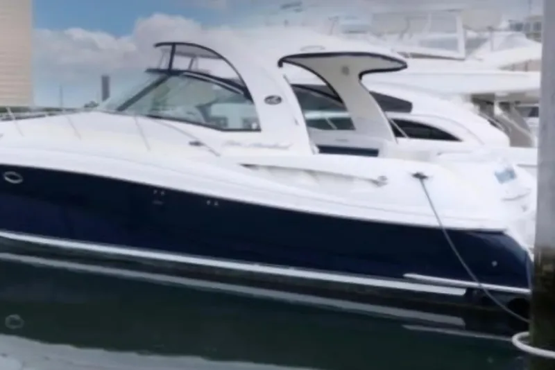 The Image of 2005 Sea Ray 500 Sundancer yacht docked in marina, showcasing sleek design and luxury features. - 0