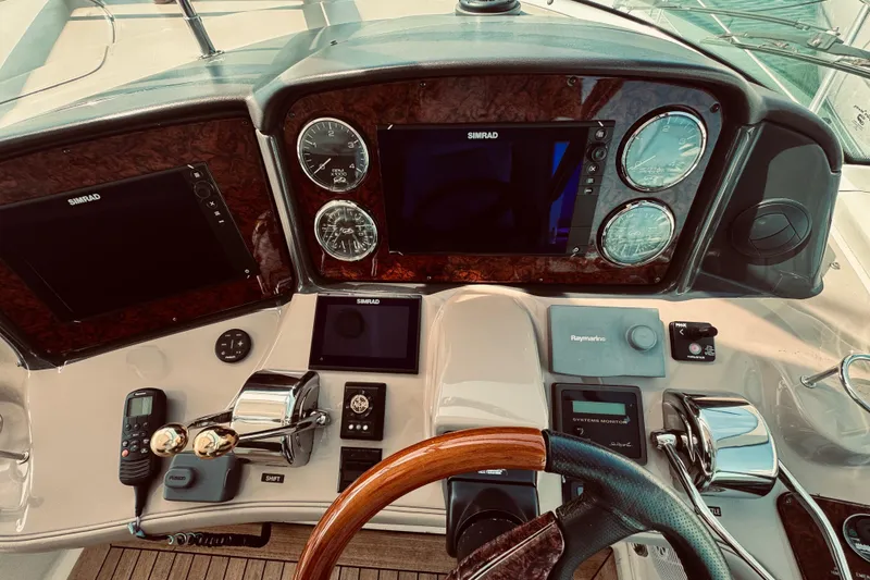 Slide: The Image of Control panel of a 2005 Sea Ray 500 Sundancer yacht with navigation instruments. - 14