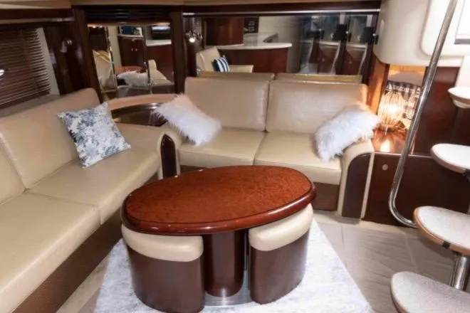 Slide: The Image of Luxurious interior of 2005 Sea Ray 500 Sundancer yacht with elegant seating and table. - 19