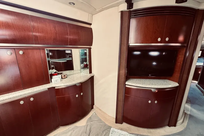 Slide: The Image of Luxurious interior of 2005 Sea Ray 500 Sundancer yacht with elegant wood cabinetry and modern amenities. - 23