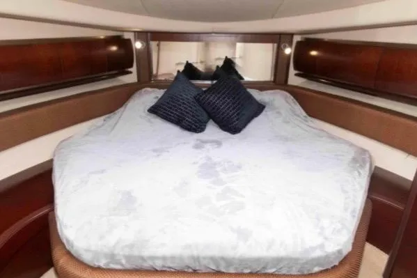 Slide: The Image of Luxurious cabin interior of 2005 Sea Ray 500 Sundancer yacht with plush bedding. - 29