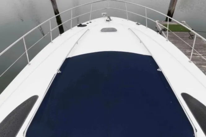 Slide: The Image of Bow view of 2005 Sea Ray 500 Sundancer yacht docked at marina. - 3