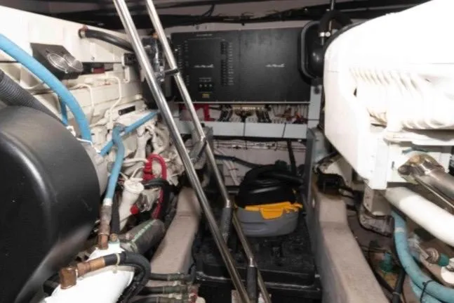 Slide: The Image of Engine room of a 2005 Sea Ray 500 Sundancer yacht, showcasing mechanical components. - 30