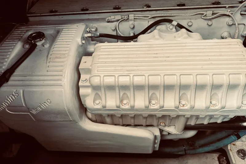 Slide: The Image of Engine compartment of a 2005 Sea Ray 500 Sundancer boat, featuring Cummins Marine components. - 32